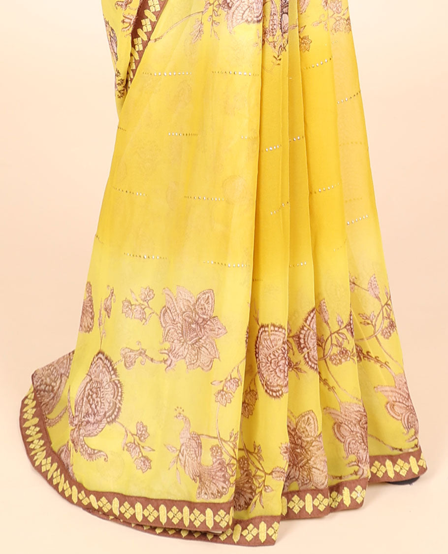 Yellow casual wear saree with floral vine designs on its body, contrast patchwork border 