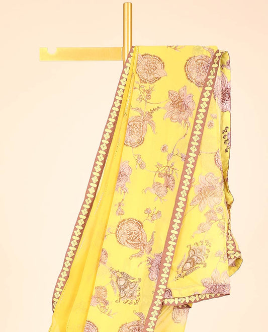 Yellow casual wear saree with floral vine designs on its body, contrast patchwork border 