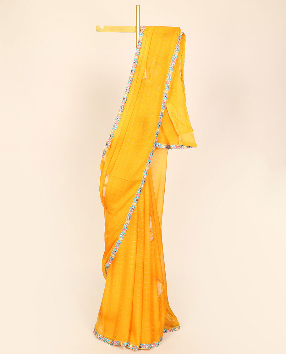 Yellow casual wear saree with stripes & buttas, floral creeper embroidered patchwork border