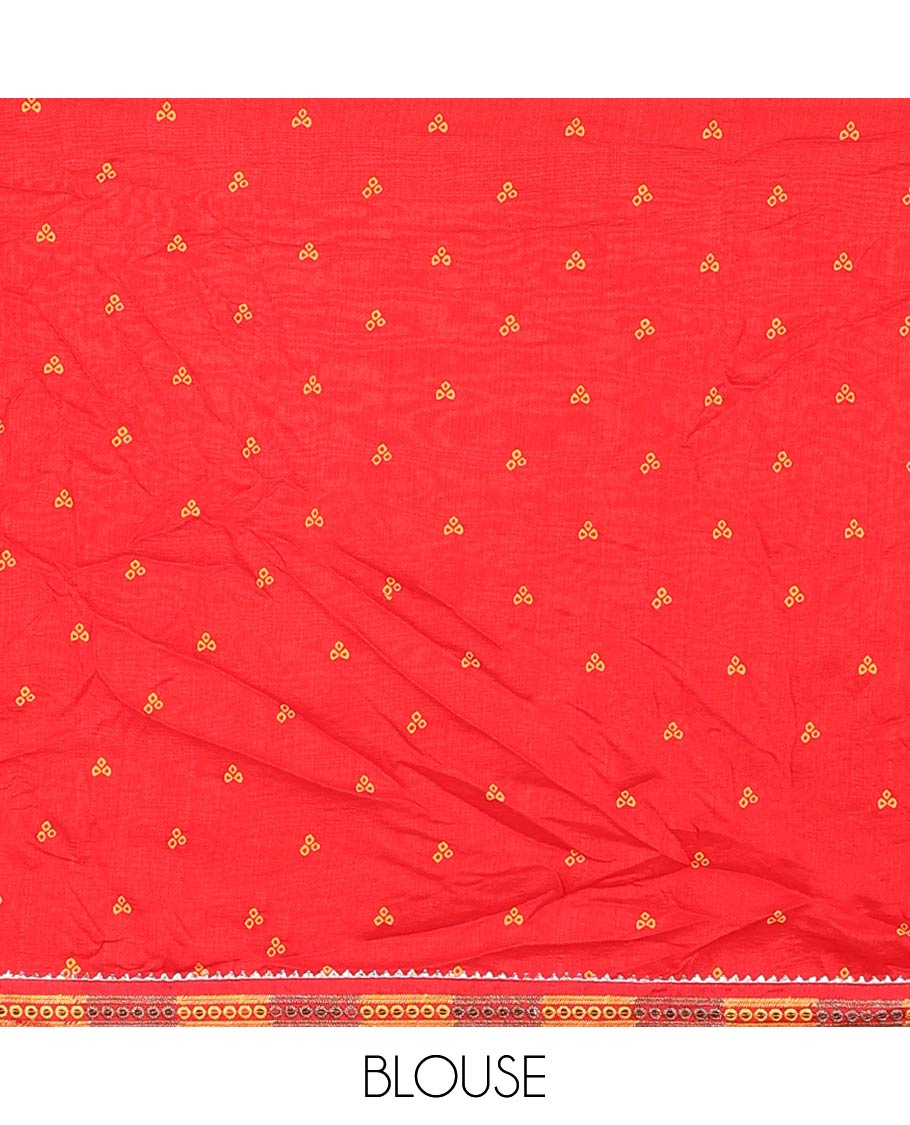 Orange bandhani polka dots printed casual wear saree features leaf creeper design, patchwork border 