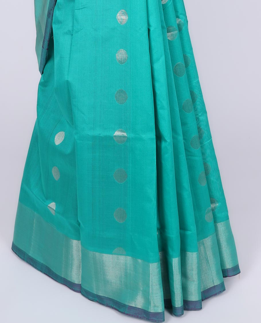 Blue kuppadam cotton saree with zari polka dot buttas, zari border & contrast pallu of ogee patterns