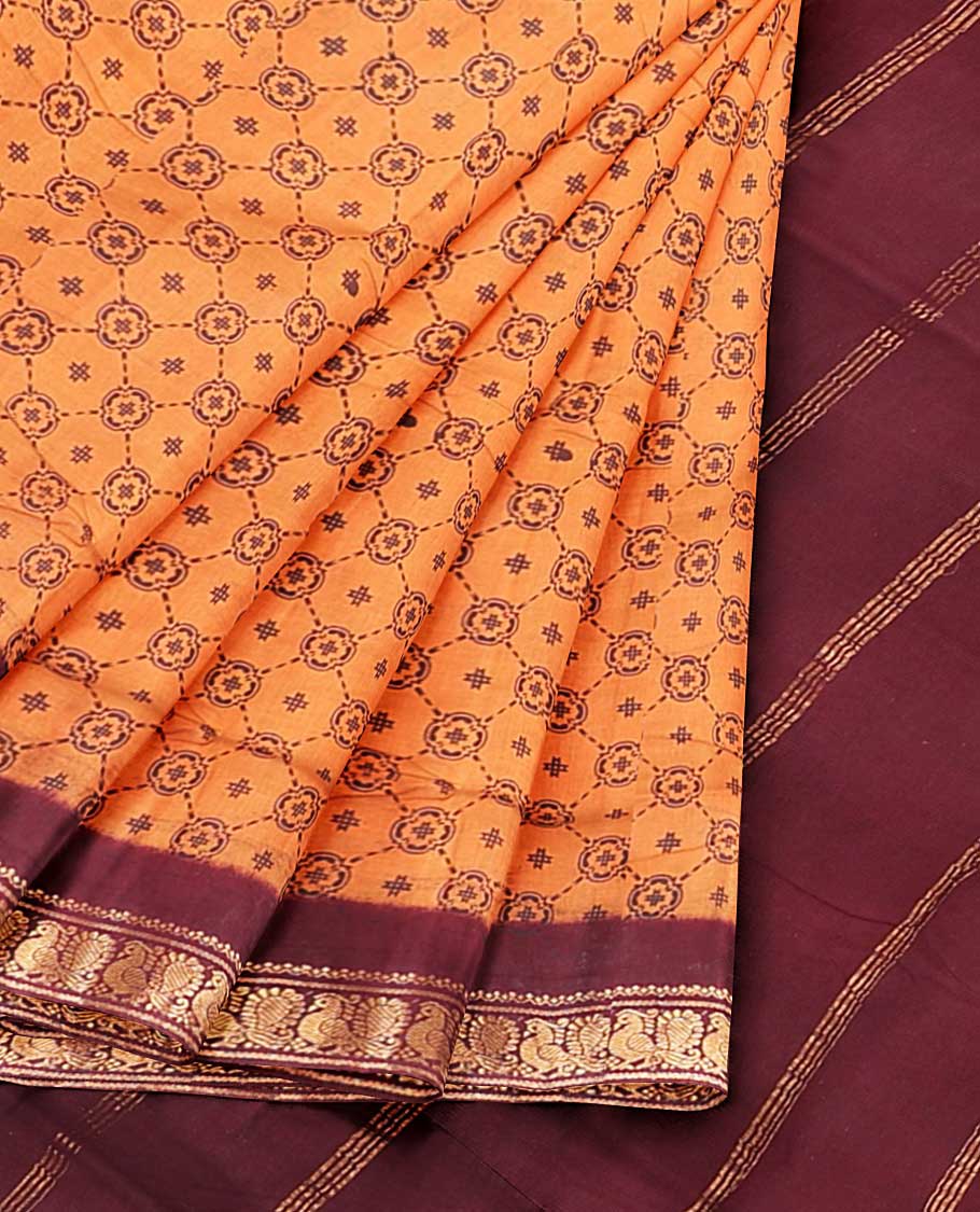 Orange geometric patterned nine-yard cotton saree, contrast peacock design border & pallu of stripes
