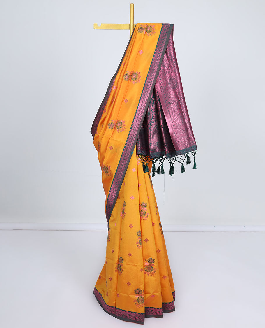 Orange butter silk saree with floral buttas, contrast rose copper zari design border & intricate palluOrange butter silk saree with floral buttas, contrast rose copper zari design border & intricate pallu