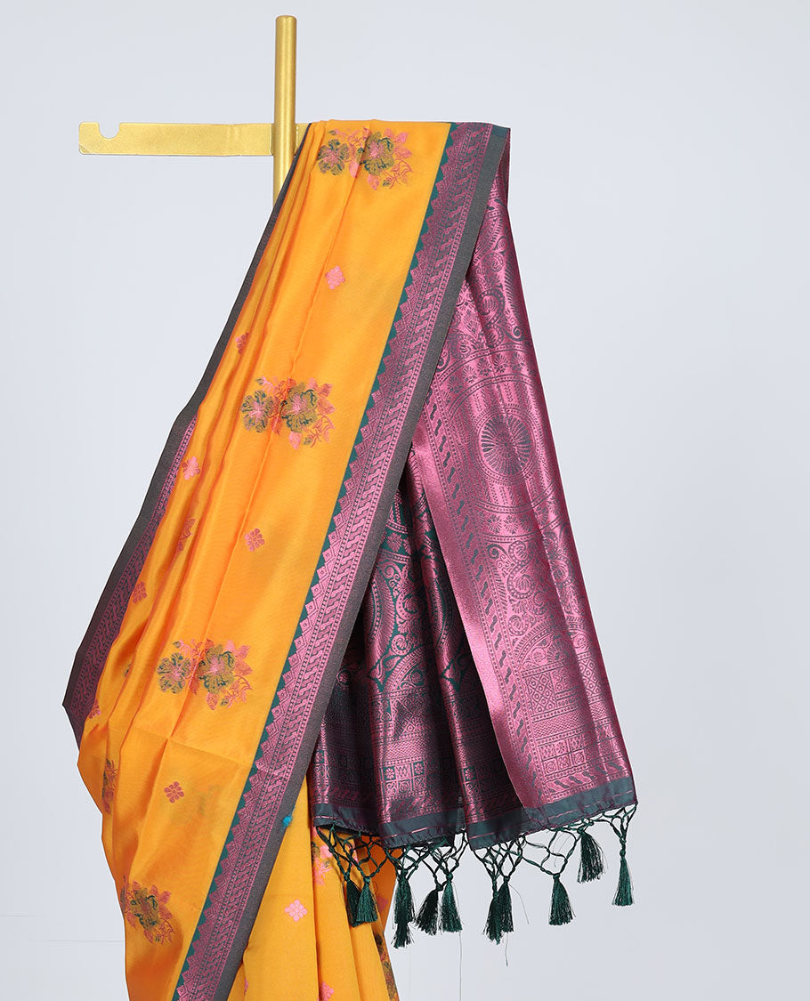 Orange butter silk saree with floral buttas, contrast rose copper zari design border & intricate palluOrange butter silk saree with floral buttas, contrast rose copper zari design border & intricate pallu
