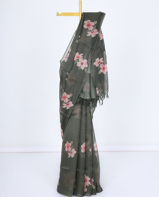 Borderless green kamala silk saree features hibiscus motifs, a contrast plain blouse