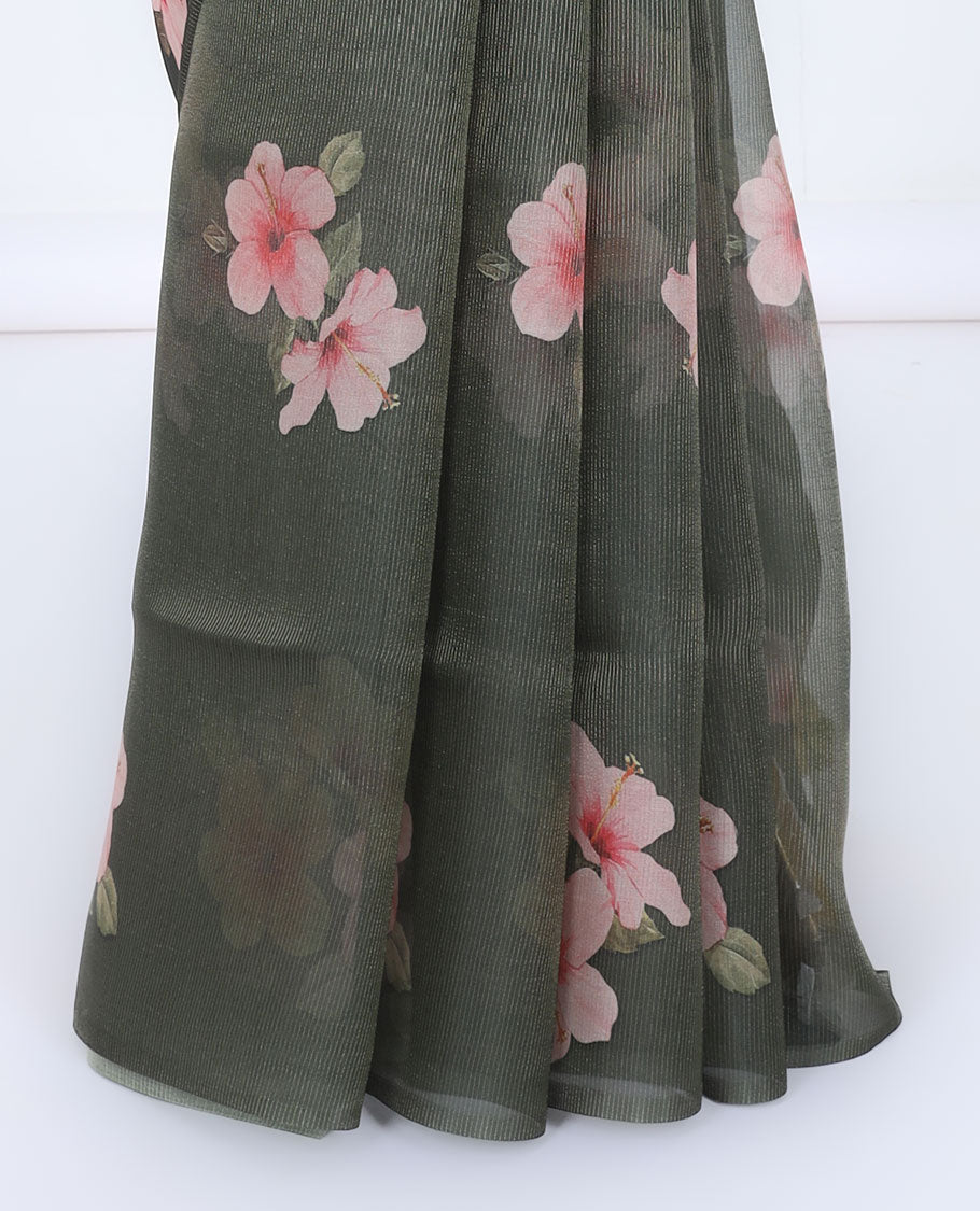 Borderless green kamala silk saree features hibiscus motifs, a contrast plain blouse