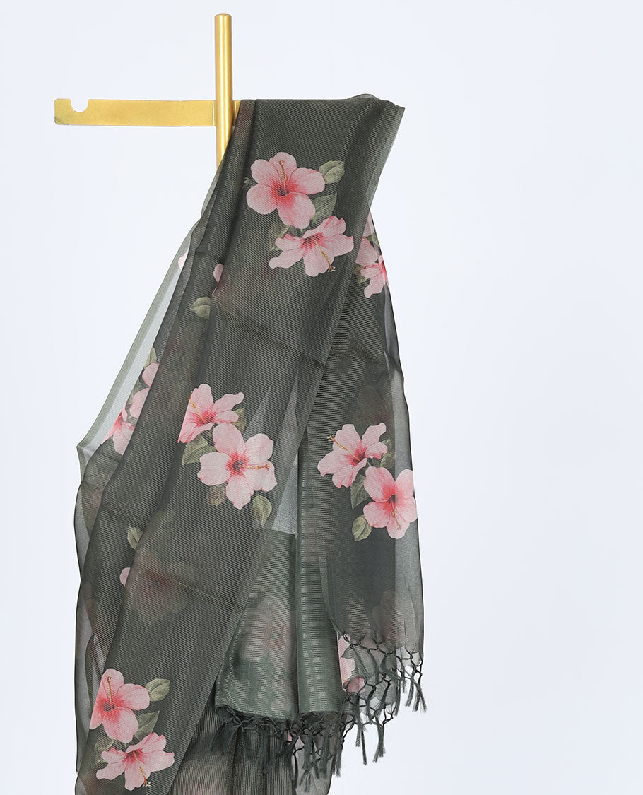 Borderless green kamala silk saree features hibiscus motifs, a contrast plain blouse