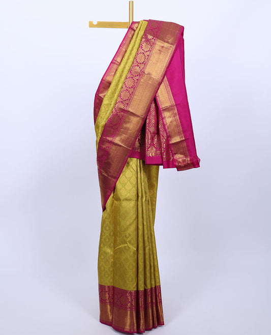 Green jacquard silksaree,contrast border of thilakam mokku,banaras,rudraksham,kodi visiry & vanki & pallu of jaal design
