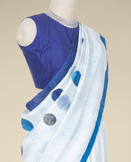 Blue printed silk saree stepped with polka dots, a plain border