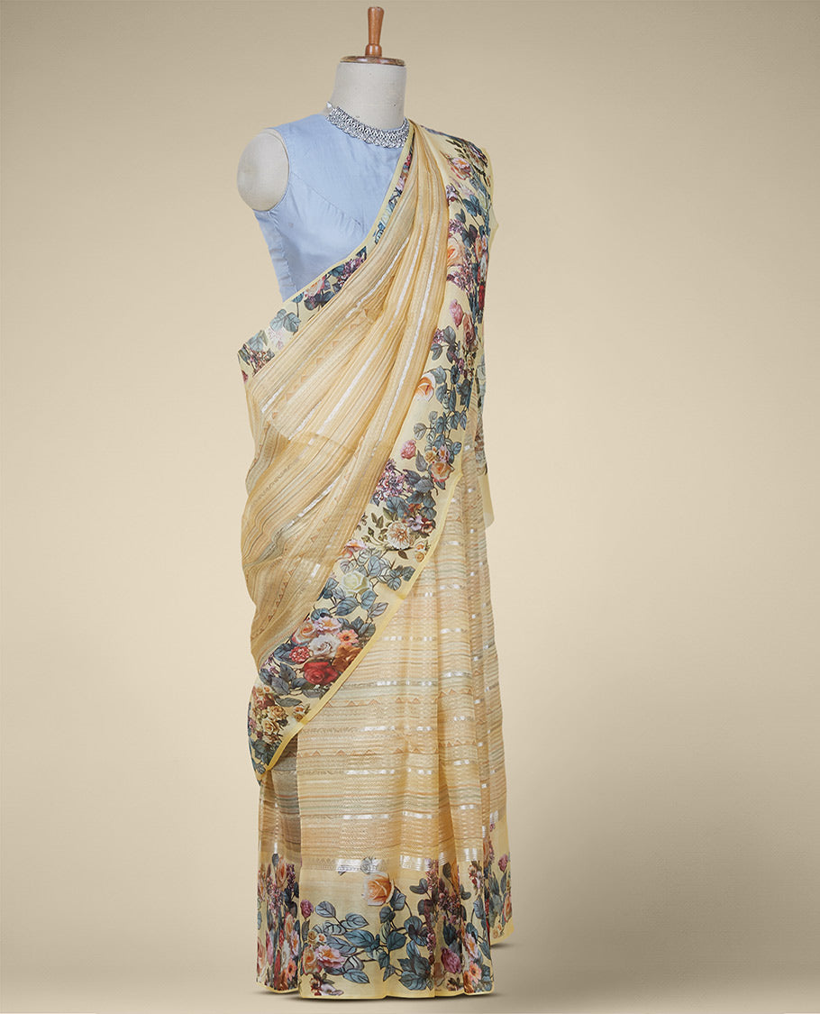 Yellow organza saree with stripes & triangle motifs on its body, kaleidoscopic-colored floral vine-printed border