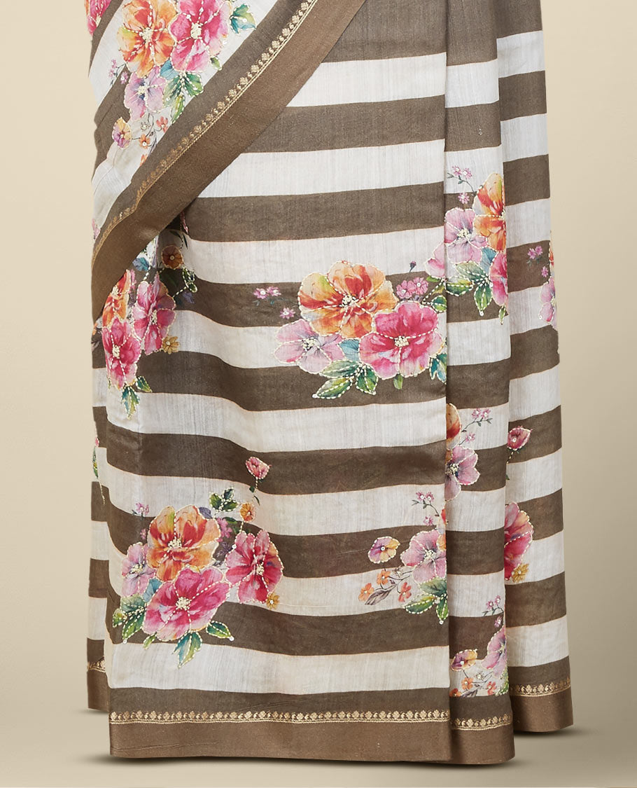 Brown striped digital printed moonga tussar saree with colorful floral motif outlined with thread embroidery,zari border