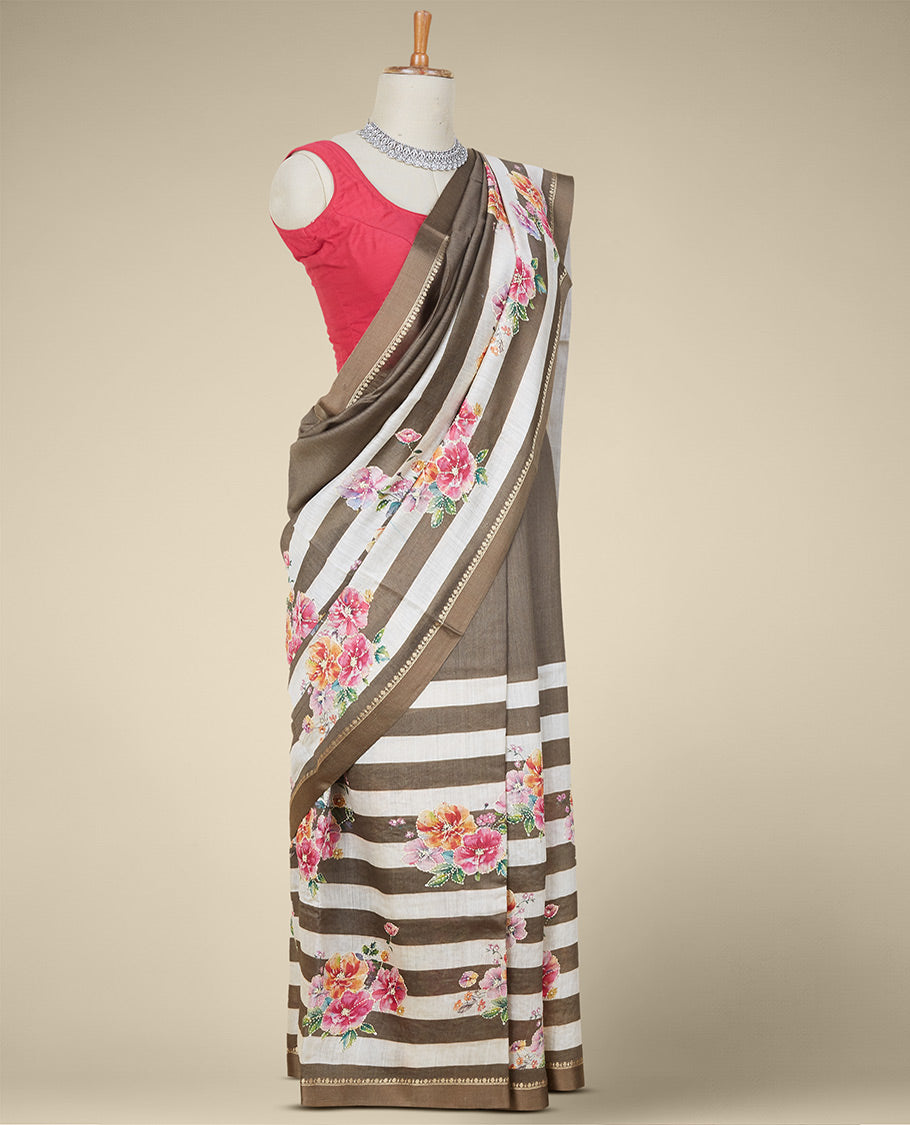 Brown striped digital printed moonga tussar saree with colorful floral motif outlined with thread embroidery,zari border
