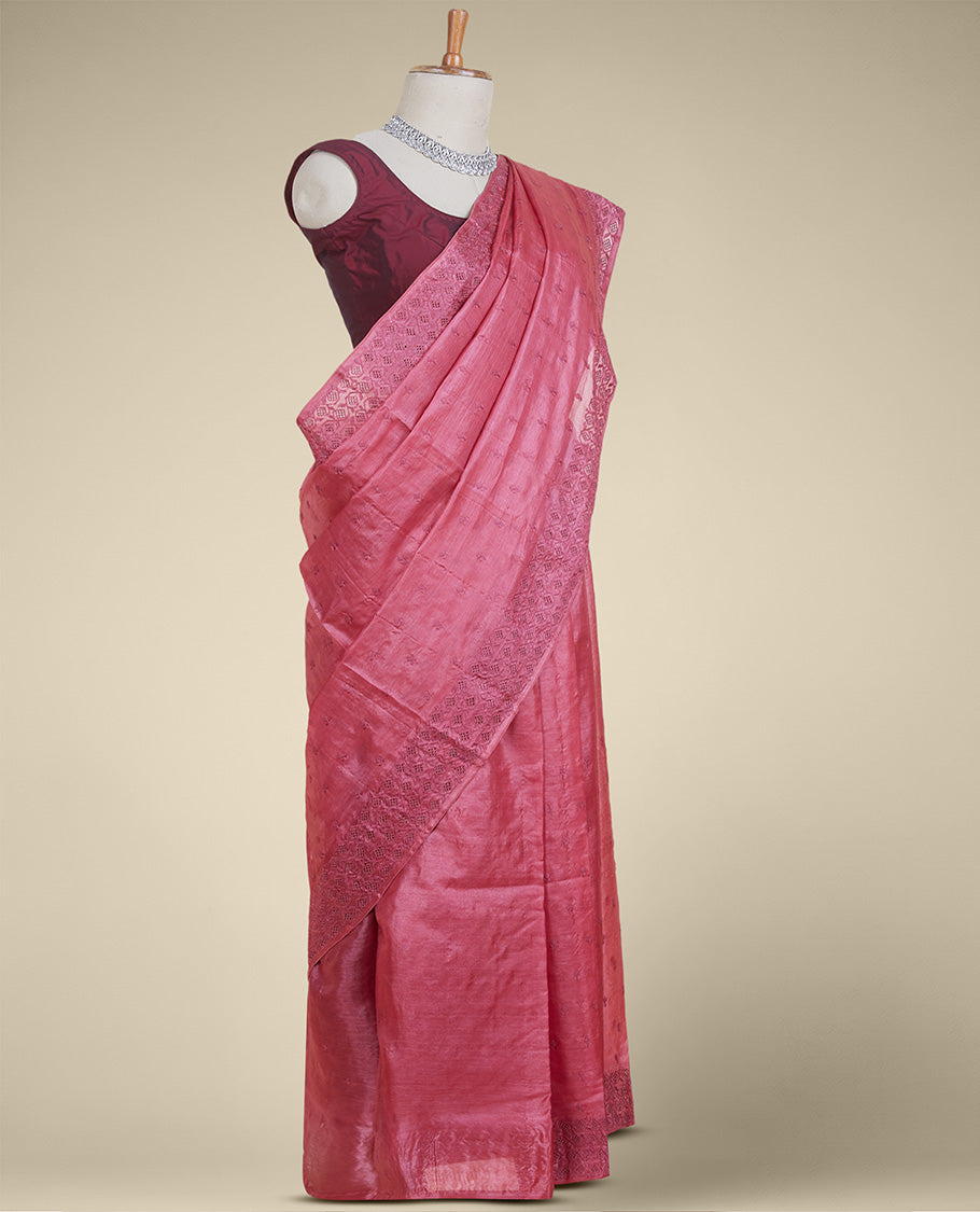Pink tusser silk saree with buttas, diamond patterned border with stone work