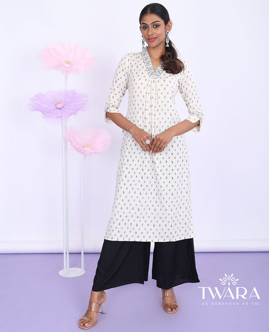 Twara cream unique motifs & embroidered v-neck with 3/4th sleeve cotton straight-cut below-knee kurti