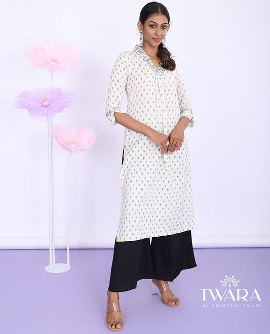 Twara cream unique motifs & embroidered v-neck with 3/4th sleeve cotton straight-cut below-knee kurti