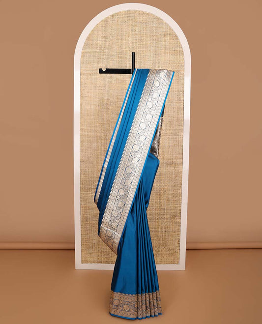 Blue semi banaras nylon saree with self floral design border & floral ogee design pallu