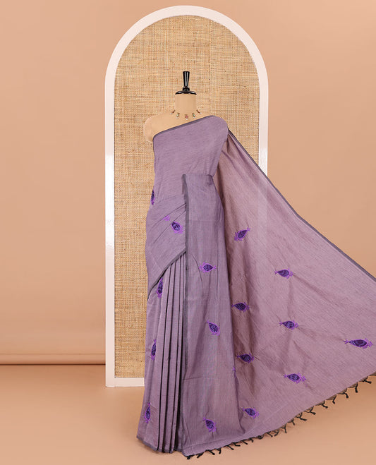 Borderless light lavender thilakam motifs patch embroidered South cotton saree with a plain blouse and a contrast ogee patterns printed blouse