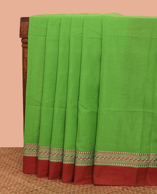 Parrot Green Plain Khadi Cotton Saree, Complemented by a Contrast Traditional Motifs Thread Woven Border, Pallu Features Stripes, and Comes Without a Blouse