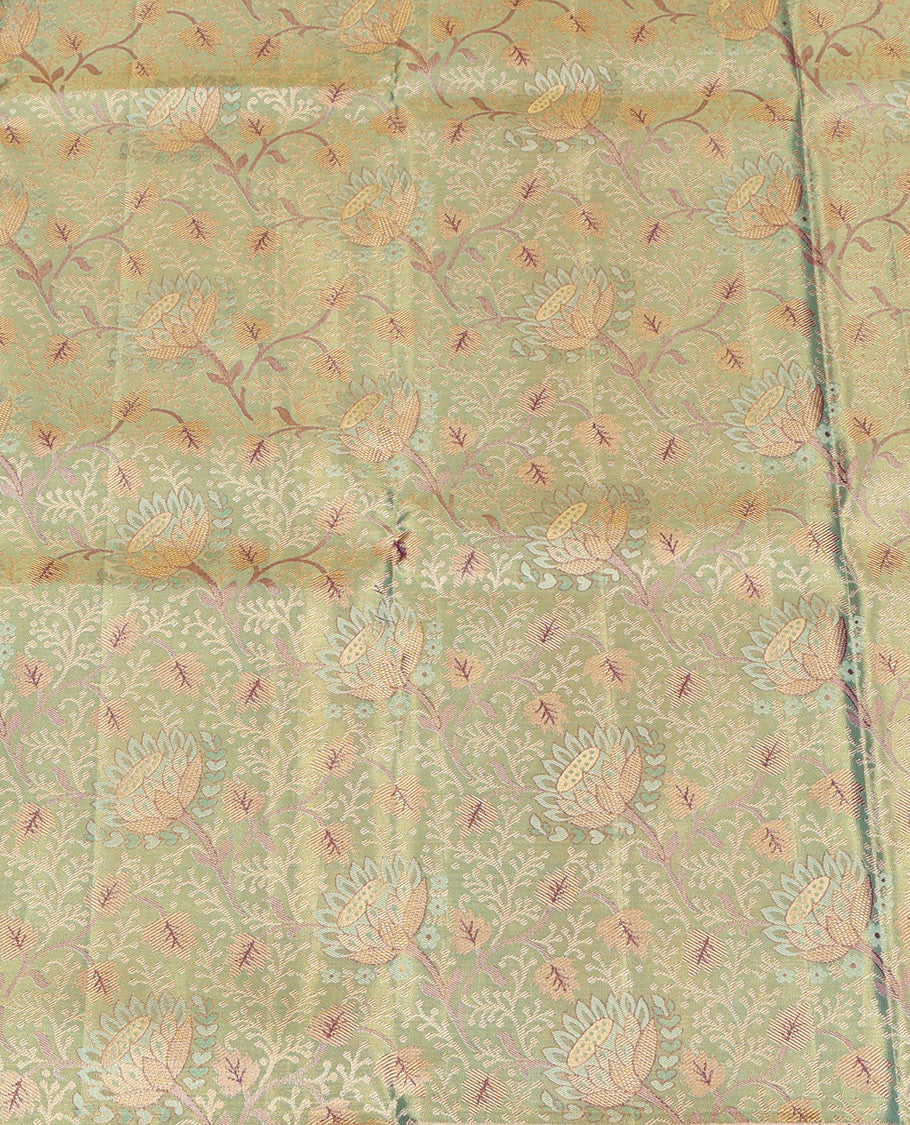 Green Pure Silk Half-Saree, Artfully Detailed with Floral Jacquard All Over Its Skirt, Complemented by a Contrast Border of Yaanai, Mayil, and Kodi Visiry Designs, Paired with a Contrast Blouse, and Comes with an Intricately Designed Dhavani