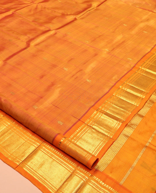 Orange Kanchipuram Silk Saree, Woven with Zari Buttas, Highlighted by a Zari One-Sided Border of Panner Sombu, Banaras, Muthu, and Jaal Design, Zari Design Pallu, and No Blouse