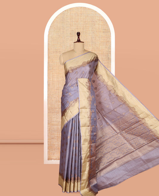 Grey Tusser Silk Saree, Accentuated with Zari Buttas, a Contrast Zari Border, Grandly Decked Up Pallu, and a Matching Blouse