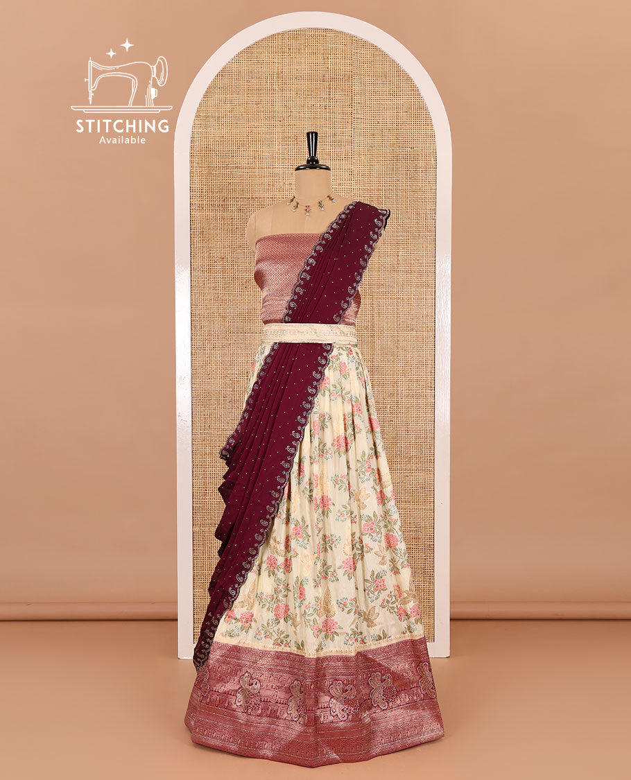 Cream and wine half-saree, floral and bird printed nylon viscose crepe top, contrast traditional zari and stone work border, jacquard banaras blouse, and scallop stone work dhavani