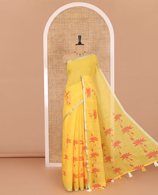 Yellow Pichwai lotus printed linen cotton saree, piping zari border, colorful tasselled lotus printed pallu, and a contrast lotus printed blouse