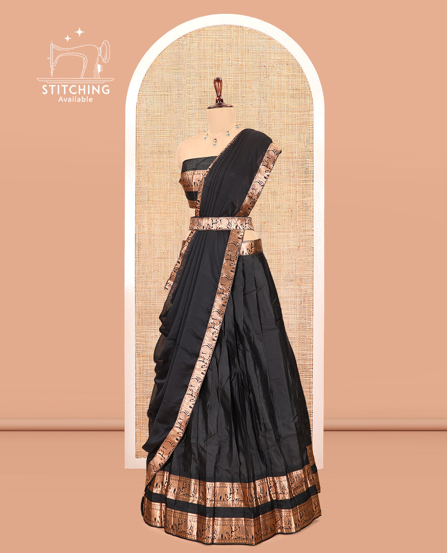 Black Semi-Silk Half-Saree Features Plain Skirt, a Rettai Pettu Elephant-Peacock Border, Matching Blouse, and a Dhavani