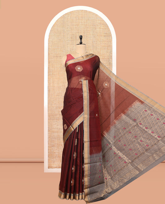 Maroon Cotton Saree, Detailed with Hexagon Zari Buttas, a Contrast Zari Butta Border, an Intricate Pallu and a Contrast Blouse