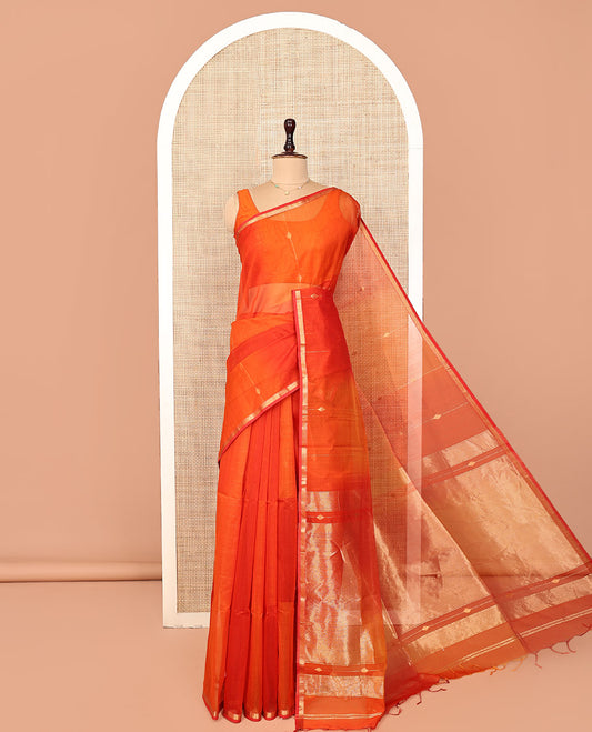 Orange Maheshwari Cotton Saree, Delicately Woven with Diamond Stripes on Its Body, Highlighted by Zari Border of Chevron Designs, Gleaming Pallu Steeped with Zari Stripes, and Paired with a Matching Blouse