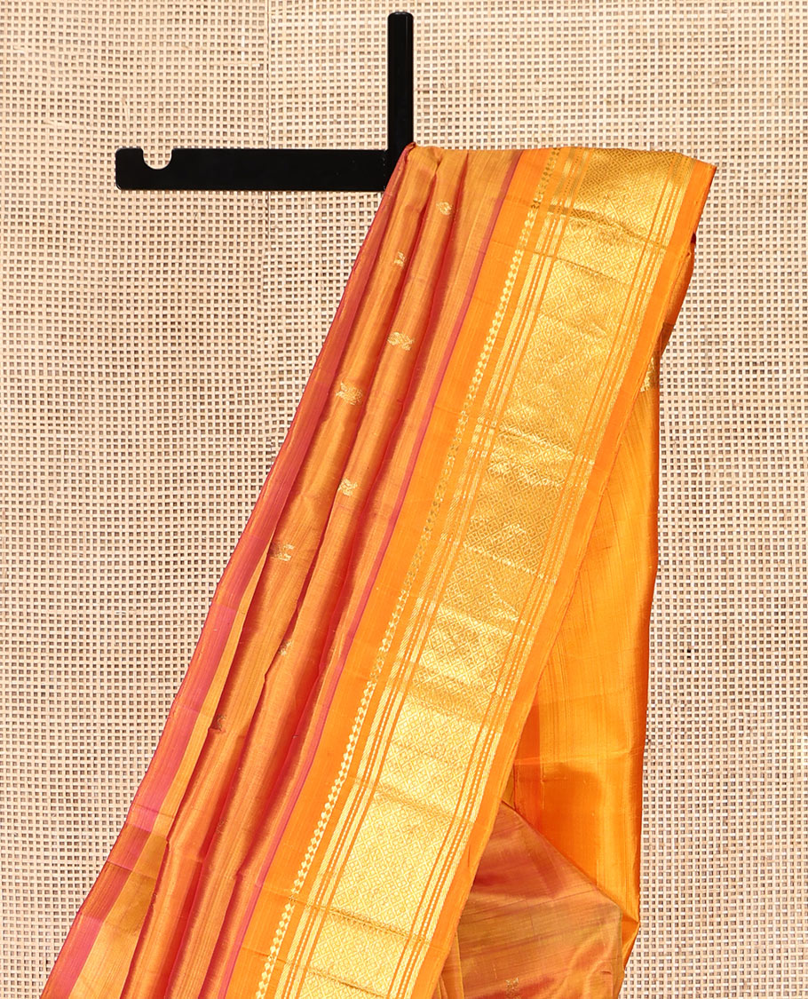 Orange Kanchipuram Silk Saree, Woven with Zari Buttas, Highlighted by a Zari One-Sided Border of Panner Sombu, Banaras, Muthu, and Jaal Design, Zari Design Pallu, and No Blouse