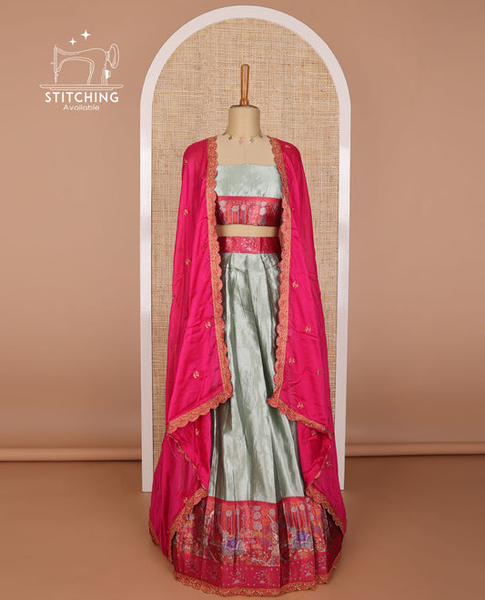 Grey tissue half saree with contrast floral, elephant design border, floral design blouse & floral embroidery, scallop border dhavani