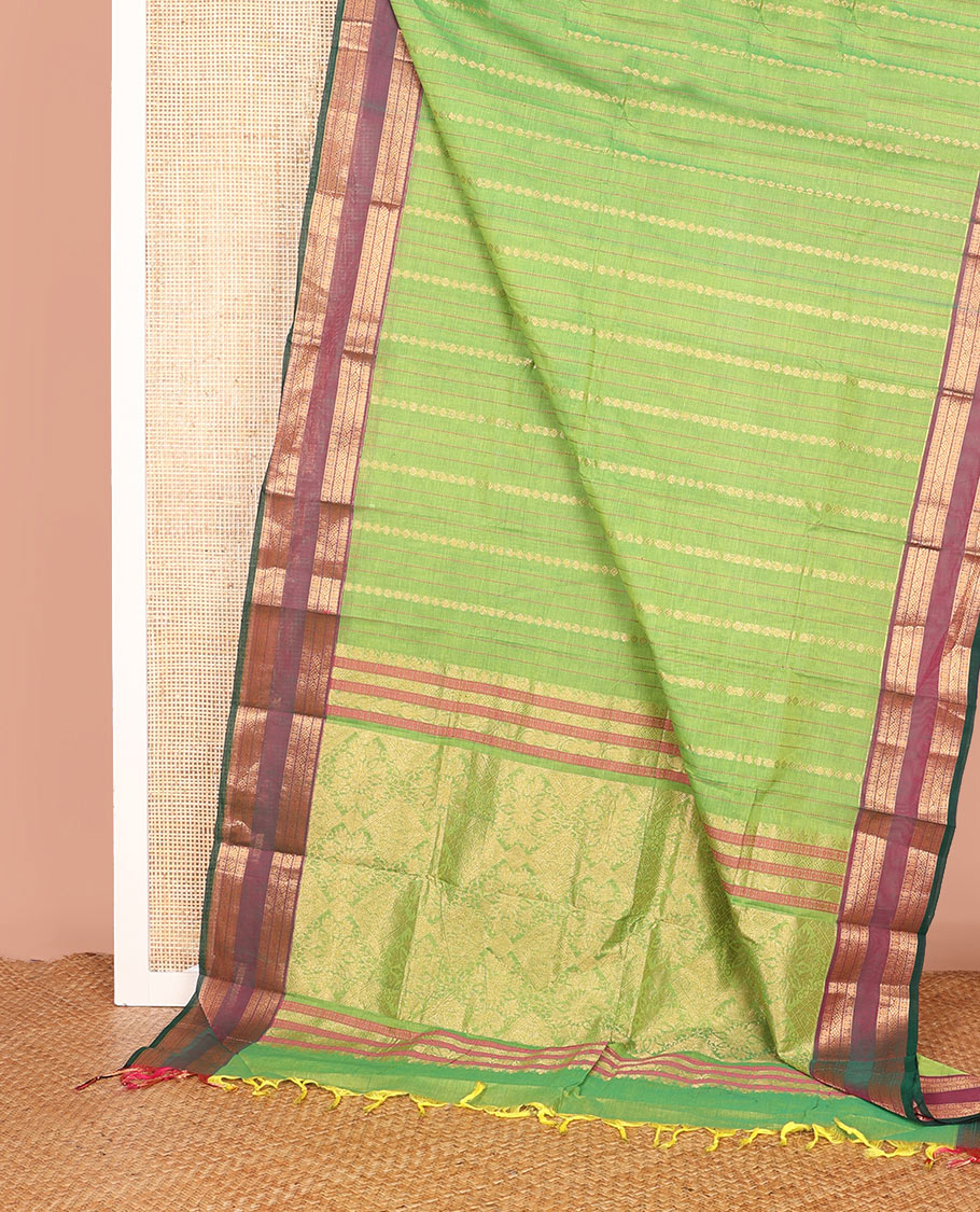 Green Chettinad Cotton Saree Delicately Woven with Buttas on Its Body, Complemented by a Contrast Traditional Zari Design Woven Rettai Pettu Border, and Elegantly Highlighted Pallu
