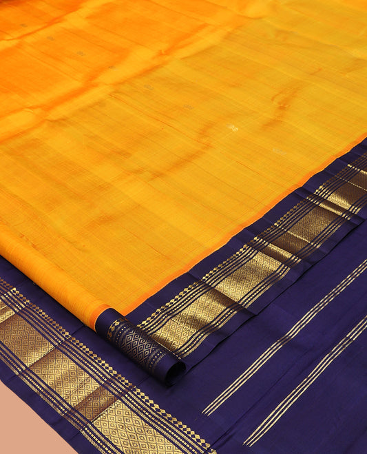 Orange Kanchipuram Silk Saree, Woven with Zari Buttas, Complemented by a Contrast Korvai Border of Panner Sombu, Banaras, Muthu, and Mayil Kann Design, Pallu of Zari Design, and No Blouse