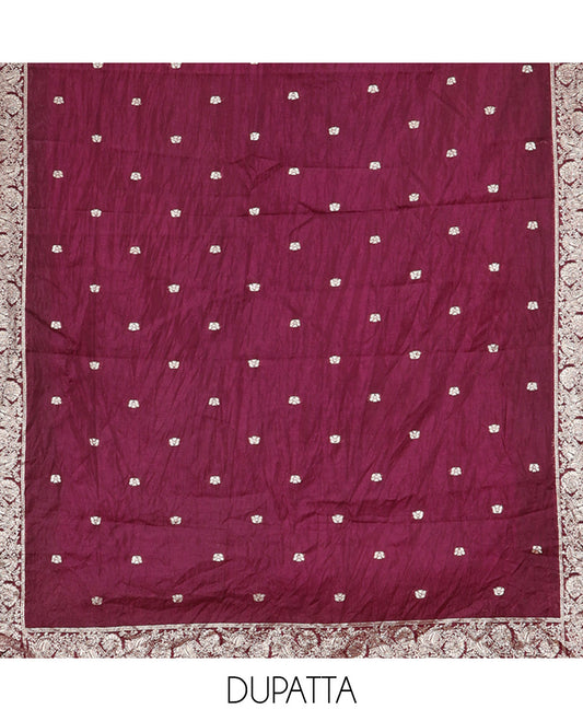 Wine Material Churidar Set Features Gold Zari Neck Work Top, a Plain Santoon Bottom, a Banarasi Dupatta