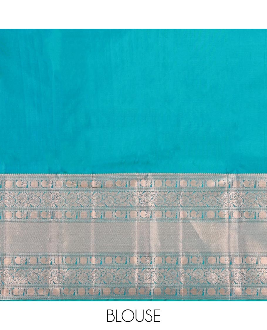 Rama Blue Kanchipuram Wedding Silk Saree, Mesmerized with Jaal Jacquard on Its Body, Highlighted by a Zari Border of Thilakam Mokku, Poun, Mayil, and Kodi Visiry Designs, Grand Pallu Steeped with Chakram Designs, and Paired with a Matching Blouse