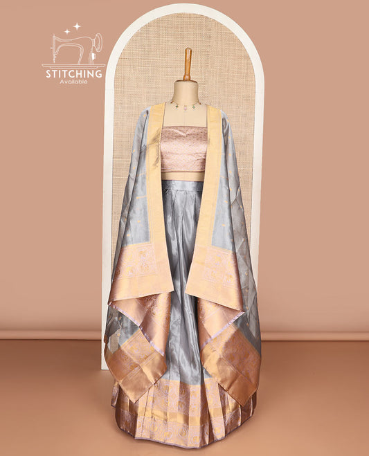 Grey tissue half saree with contrast intricate zari design border, zari design blouse & zari design border dhavani