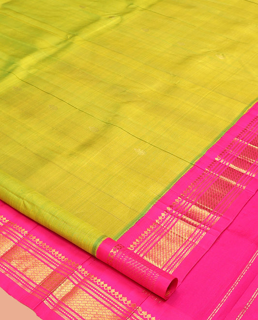 Green Kanchipuram Silk Saree, Woven with Zari Buttas, a Contrast One-Sided Korvai Border of Salngai, and Banaras Designs, a Zari Design Pallu, and No Blouse