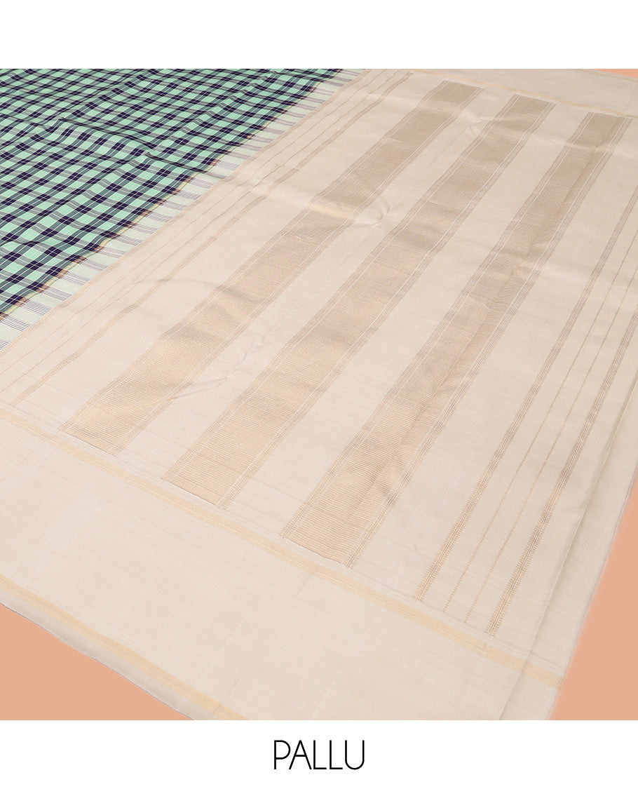 Green-Blue Checked Kanchipuram Silk Saree, Complemented by a Contrast Thazampoo Rekku Bodi Border, Sparsely Woven Pallu, and Contrast Blouse