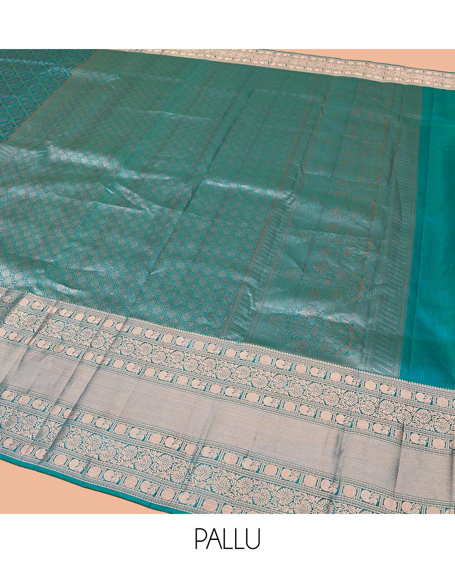 Rama Blue Kanchipuram Wedding Silk Saree, Mesmerized with Jaal Jacquard on Its Body, Highlighted by a Zari Border of Thilakam Mokku, Poun, Mayil, and Kodi Visiry Designs, Grand Pallu Steeped with Chakram Designs, and Paired with a Matching Blouse