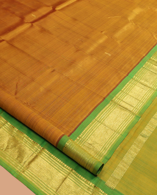 Mustard Kanchipuram Silk Saree, Elevated with Zari Buttas, a Contrast One-Sided Border of Rekku, Banaras, Muthu, and Mayil Design, Zari Design Pallu, and No Blouse