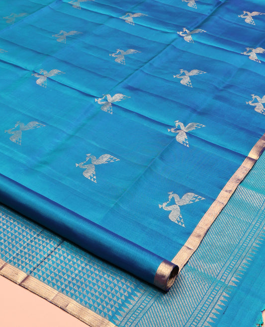 Blue Mayuri Soft Silk Saree, Steeped in the Richness of Mayil Buttas, a Piping Border, Pallu of Ara Maadam Designs, and a Matching Blouse
