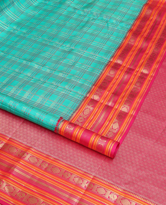 Green checked vasundhara elite silk saree with contrast traditional zari design border & intricate jaal design pallu