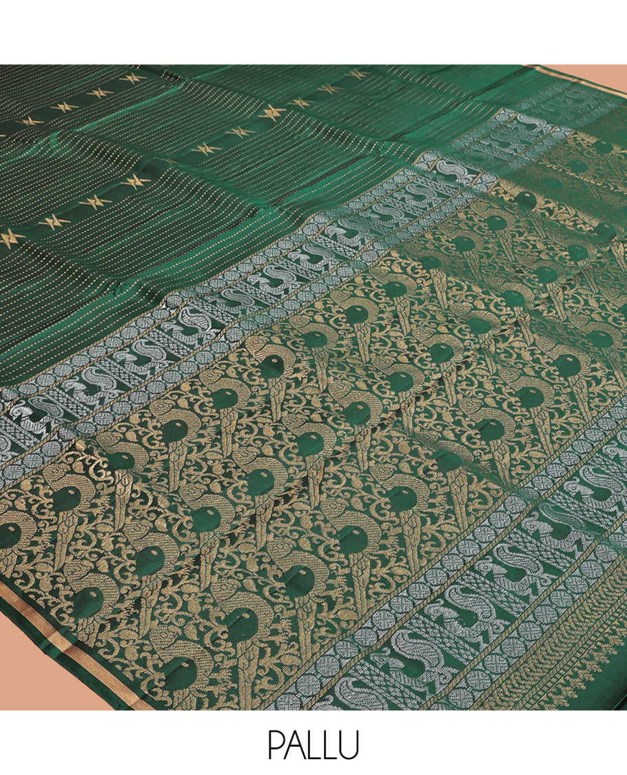 Green Mayuri Lite Silk Mix Saree, Accentuated with Floral Zari Buttas and Muthu Stripes, a Piping Border, a Grand Parrot Motif Pallu, and a Matching Blouse