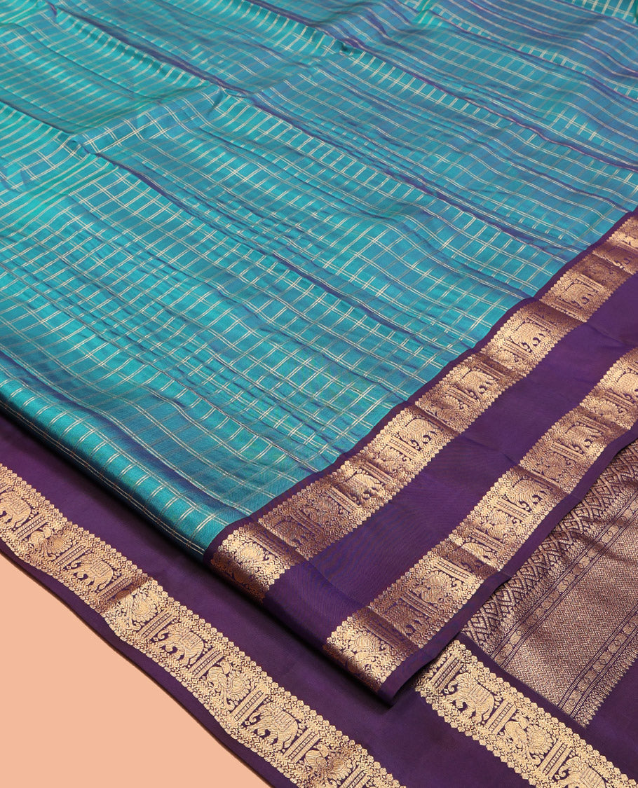 Blue Vasundhara Lite Silk Mix Saree, Spotlighted with Checks, Complemented by a Contrast Rettai Pettu Border of Thilakam Mokku, Yaanai and Mayil Design, Jaal Pallu, and a Contrast Blouse