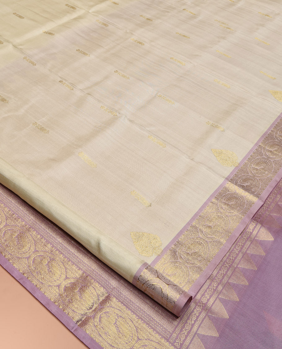 Off-White Venkatagiri Silk Saree, Spotlighted with Zari Buttas All Over Its Body, Complemented by a Contrast Traditional Zari Design Border, Grand Pallu, and Paired with a Contrast Blouse