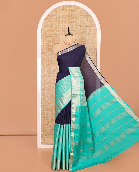 Navy Blue and Rama Half-And-Half Style Art Crepe Saree Richly Detailed with Plain and Jacquard Design, Complemented by a Contrast Border of Traditional Zari Designs, Pallu Featuring Zari Stripes, and Paired with a Matching Blouse