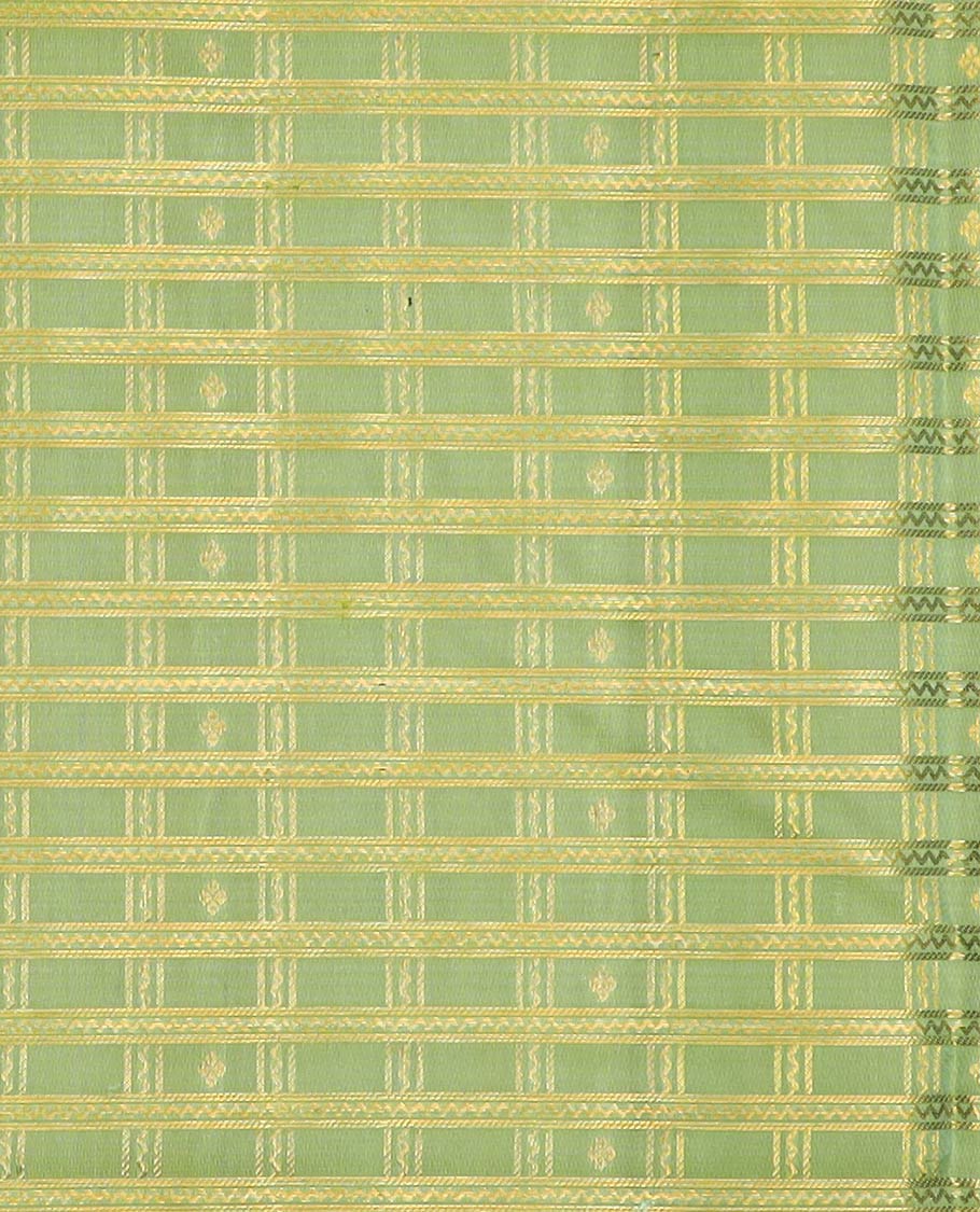 Green pure-silk half-saree, zari buttas and checked skirt, contrast kuyil kann and kodi manga border, zari design blouse, and a intricate zari woven dhavani