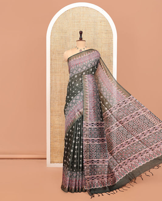 Black Tussar Silk Saree, Adorned with Buttas, Artfully Designed Ajrakh Printed Border, a Pallu of Ajrakh Print, and a Contrast Blouse