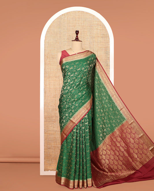 Green Mysore Silk Saree, Embellished with Lotus Vine and Pichwai Cow Designs, Complemented by a Contrast Traditional Zari Border, Grand Pallu, and a Contrast Blouse